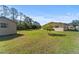 Expansive backyard featuring lush green grass and a shed, ideal for outdoor enjoyment at 717 Wedge Ln, Kissimmee, FL 34759