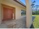 Covered front porch and front door with stone accents at 717 Wedge Ln, Kissimmee, FL 34759