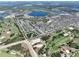 An aerial view shows this home is part of a large community near a golf course and lake at 8016 Sweet Orange Ave, Winter Garden, FL 34787