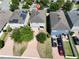 Aerial view of townhomes, showcasing brick paved driveways and well-maintained yards in a neatly arranged community at 8016 Sweet Orange Ave, Winter Garden, FL 34787