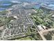 An aerial view shows this home is part of a large community near a golf course and multiple lakes at 8016 Sweet Orange Ave, Winter Garden, FL 34787
