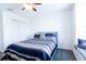 A bright bedroom boasts neutral walls, carpet, a window seat and a large window to let the light stream in at 8016 Sweet Orange Ave, Winter Garden, FL 34787