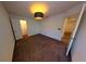 Bedroom features a pendant light, neutral carpeting, and walk-in closet at 8016 Sweet Orange Ave, Winter Garden, FL 34787
