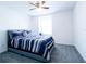A bright bedroom boasts neutral walls, carpet, a window seat and a large window to let the light stream in at 8016 Sweet Orange Ave, Winter Garden, FL 34787