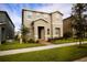 Beautiful two-story home with manicured landscaping, showcasing a modern facade and a welcoming front entrance at 8016 Sweet Orange Ave, Winter Garden, FL 34787