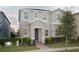 Inviting two-story home with landscaped front yard, featuring a covered entryway and neutral exterior paint at 8016 Sweet Orange Ave, Winter Garden, FL 34787
