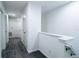 Bright hallway with white walls and neutral carpeting provides access to multiple rooms at 8016 Sweet Orange Ave, Winter Garden, FL 34787