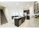 Beautiful kitchen area with granite countertops, stainless steel appliances, and bar stool seating at 8016 Sweet Orange Ave, Winter Garden, FL 34787