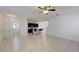 Spacious living area showcasing open concept with kitchen, bar seating, and tile flooring at 8016 Sweet Orange Ave, Winter Garden, FL 34787