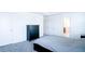 An uncluttered, neutral-toned main bedroom boasts plush carpeting, tray ceilings and easy access to the en suite bathroom at 8016 Sweet Orange Ave, Winter Garden, FL 34787