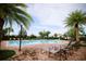 Community pool with lounge chairs surrounded by lush landscaping, offering a relaxing retreat at 8016 Sweet Orange Ave, Winter Garden, FL 34787