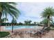 Community pool with lounge chairs surrounded by lush landscaping, offering a relaxing retreat at 8016 Sweet Orange Ave, Winter Garden, FL 34787