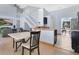 Open dining area with staircase, dark wood table, and view to the living room at 8603 Black Creek Blvd, Orlando, FL 32829
