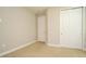 Carpeted bedroom with ample space and standard closet at 8742 Peachtree Park Ct, Windermere, FL 34786