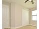 Spacious bedroom features a ceiling fan, closet, and a window at 8742 Peachtree Park Ct, Windermere, FL 34786