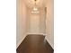 Inviting entryway with wood floors, a stylish light fixture, and a view into the home at 8742 Peachtree Park Ct, Windermere, FL 34786
