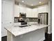 Gourmet kitchen featuring granite counters, subway tile backsplash, and stainless steel appliances at 8742 Peachtree Park Ct, Windermere, FL 34786