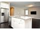 Kitchen island featuring granite countertops, stainless steel dishwasher and faucet at 8742 Peachtree Park Ct, Windermere, FL 34786