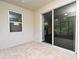 Cozy patio featuring brick flooring and sliding glass doors leading into the home's interior at 8742 Peachtree Park Ct, Windermere, FL 34786