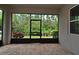 Screened patio features brick floor and views of the backyard at 8742 Peachtree Park Ct, Windermere, FL 34786