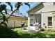 Backyard with outdoor grill and patio area, perfect for entertaining and enjoying outdoor meals at 9573 Southern Garden Cir, Altamonte Springs, FL 32714