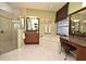 Bathroom featuring a spacious bathtub, glass-enclosed shower, and granite topped vanity with dual mirrors at 9573 Southern Garden Cir, Altamonte Springs, FL 32714