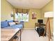 Cozy bedroom featuring a daybed, desk, large window, and bright natural light at 9573 Southern Garden Cir, Altamonte Springs, FL 32714