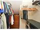 Organized walk-in closet with shelves, hanging rods, and built-in dresser for optimal storage at 9573 Southern Garden Cir, Altamonte Springs, FL 32714