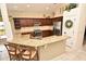 Kitchen featuring granite countertops, stainless steel appliances and dark wood cabinets with tile flooring at 9573 Southern Garden Cir, Altamonte Springs, FL 32714