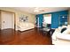 Living room featuring hardwood floors, and a stylish gallery wall, providing a cozy atmosphere at 9573 Southern Garden Cir, Altamonte Springs, FL 32714