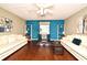 Versatile home office with hardwood flooring, bookshelves, and natural light, perfect for remote work at 9573 Southern Garden Cir, Altamonte Springs, FL 32714