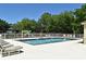 Community pool and playground offer residents recreation and relaxation on a sunny day at 9573 Southern Garden Cir, Altamonte Springs, FL 32714