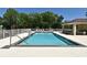 Community swimming pool with lounge chairs, shaded pavilion, and surrounded by trees at 9573 Southern Garden Cir, Altamonte Springs, FL 32714