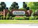 Community entrance sign for Camden Club, featuring lush landscaping and brick pillars at 9573 Southern Garden Cir, Altamonte Springs, FL 32714