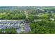 This aerial view shows a neighborhood with lush trees at 1005 Talon Pl, Winter Springs, FL 32708
