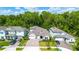 Aerial view of a well-maintained home with manicured lawn and an attached three-car garage at 1005 Talon Pl, Winter Springs, FL 32708