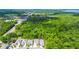 Community aerial view showing homes backing up to a mature tree line at 1005 Talon Pl, Winter Springs, FL 32708