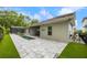 A backyard with a large stone patio, plunge pool, and screened in pool at 1005 Talon Pl, Winter Springs, FL 32708