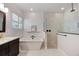 Elegant bathroom featuring a standalone tub, and a modern shower at 1005 Talon Pl, Winter Springs, FL 32708