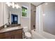 Bathroom featuring a shower and bathtub, with a modern vanity and neutral color scheme at 1005 Talon Pl, Winter Springs, FL 32708