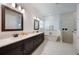 This bathroom features a double vanity, standalone tub, and walk-in shower at 1005 Talon Pl, Winter Springs, FL 32708