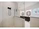 Beautiful shower with white marble tile and an adjacent vanity with dark cabinets at 1005 Talon Pl, Winter Springs, FL 32708