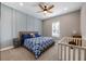 Cozy bedroom with stylish decor and a ceiling fan at 1005 Talon Pl, Winter Springs, FL 32708