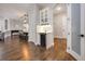Spacious dining area with hardwood floors, a wine fridge, and modern light fixture at 1005 Talon Pl, Winter Springs, FL 32708