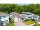 Beautiful two-story home featuring well-maintained landscaping, a three-car garage and a welcoming front porch at 1005 Talon Pl, Winter Springs, FL 32708