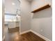 Hallway featuring hardwood floors and a view of the kitchen at 1005 Talon Pl, Winter Springs, FL 32708