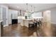 Spacious kitchen with hardwood floors, an island, and white cabinetry at 1005 Talon Pl, Winter Springs, FL 32708