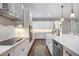 Stylish kitchen with stainless steel appliances, quartz countertops, and hardwood flooring at 1005 Talon Pl, Winter Springs, FL 32708