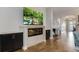 Cozy living room with shiplap accent wall, electric fireplace, and hardwood floors at 1005 Talon Pl, Winter Springs, FL 32708