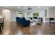 Bright living room with a fireplace, shiplap accent wall, hardwood floors, and comfortable seating at 1005 Talon Pl, Winter Springs, FL 32708